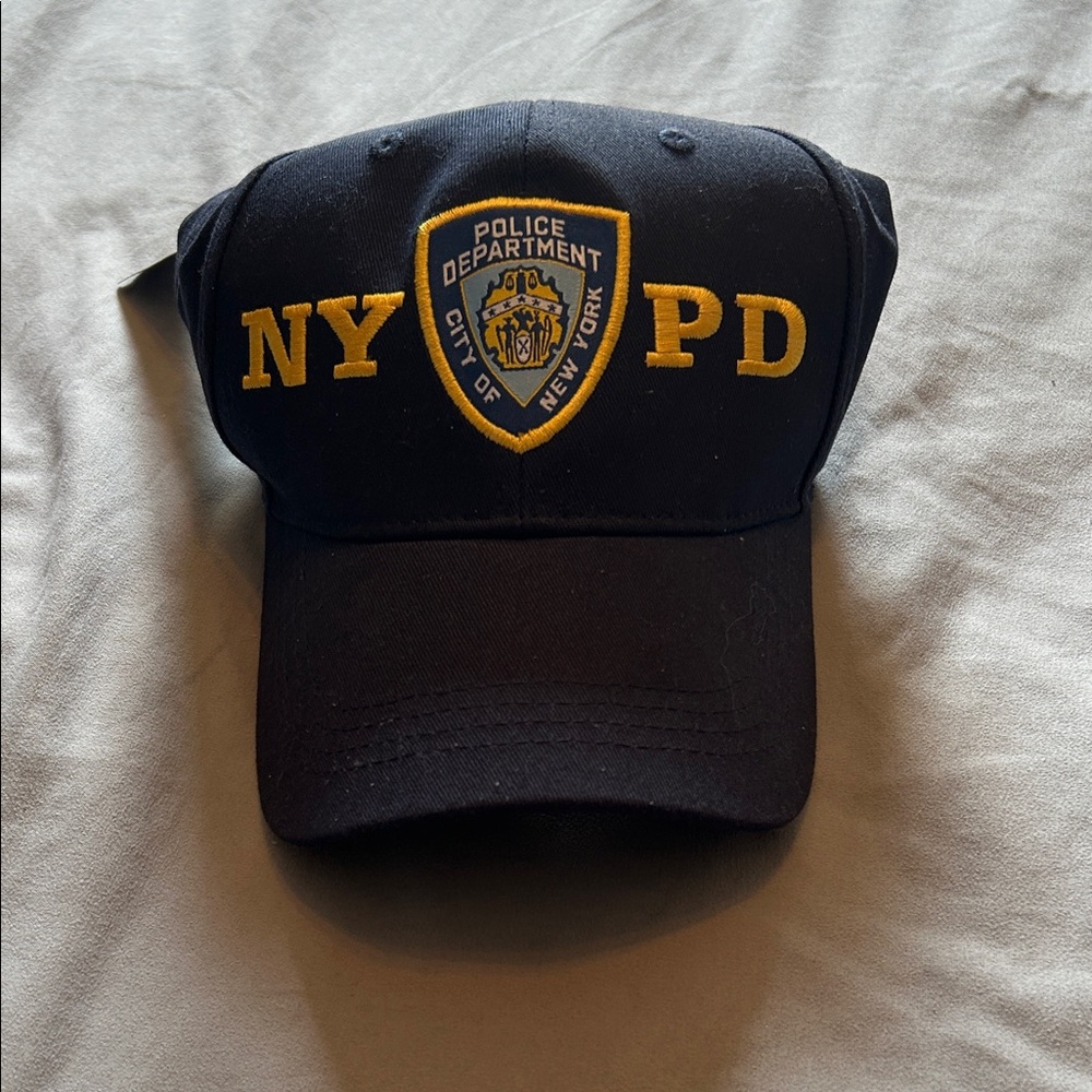 NWT NYPD adjustable hat. Navy blue with gold embroidered lettering